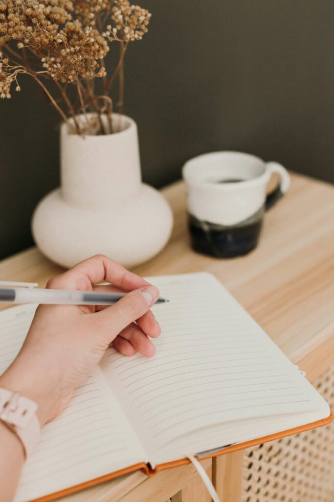 A woman is journaling.